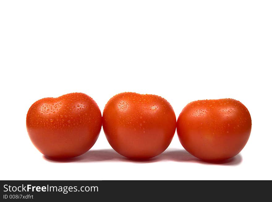 Red tomatoes on white background