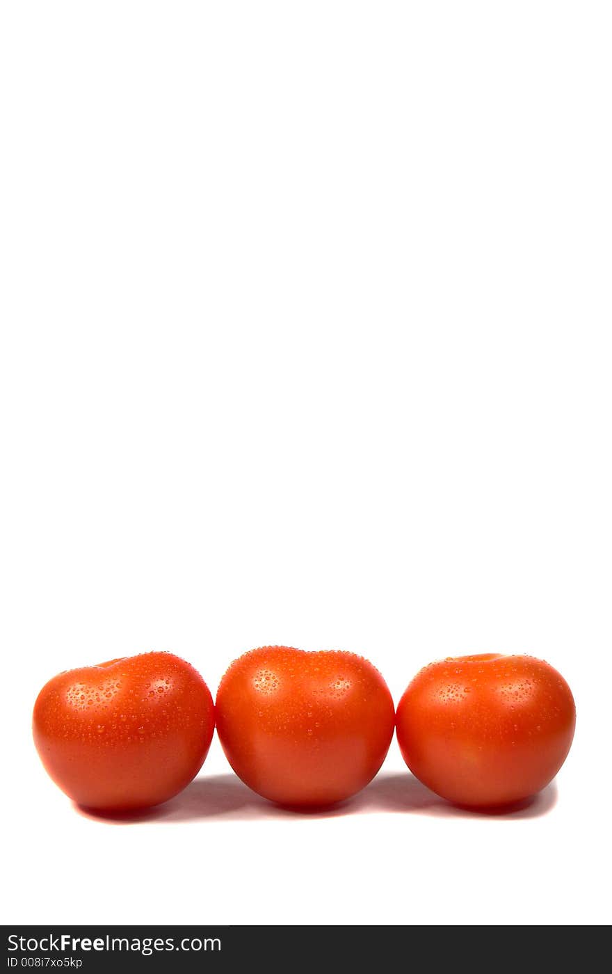 Red tomatoes on white background