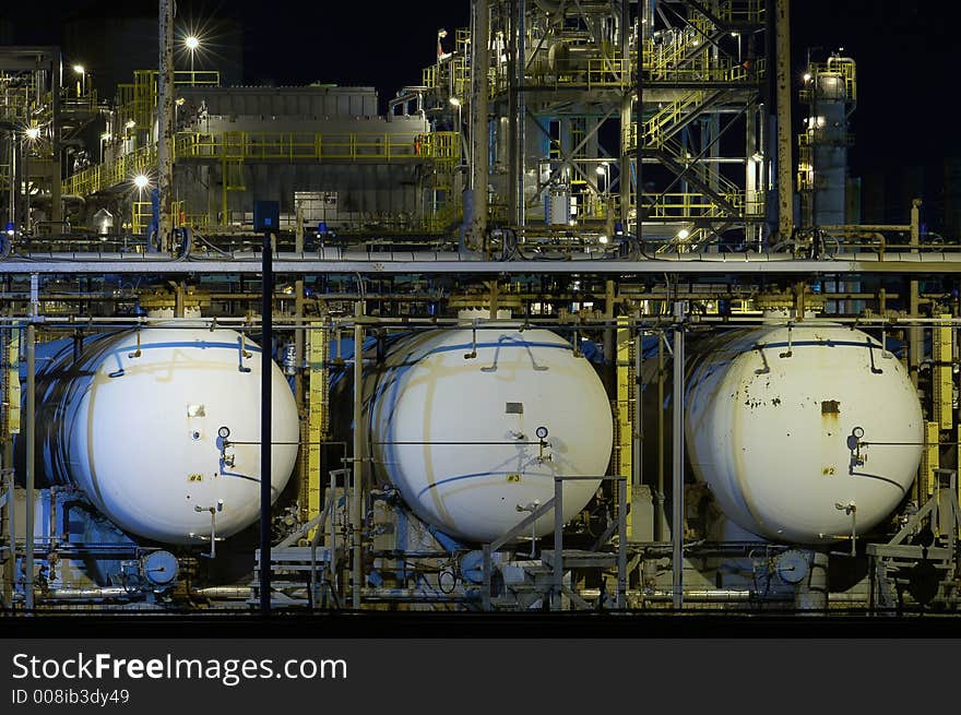 Three oil tanks at night