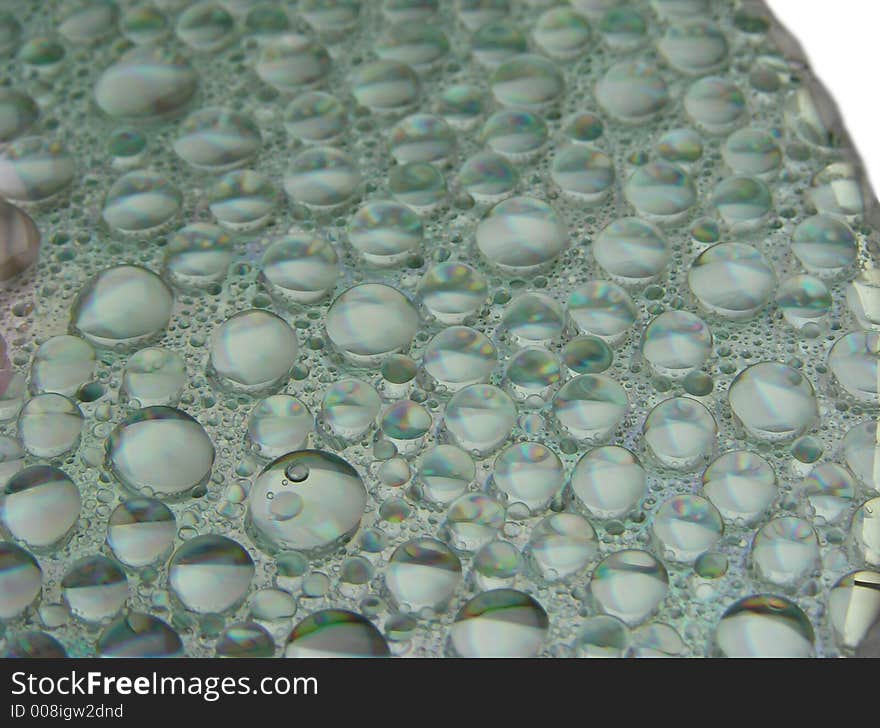 Water drops on a surface of compact disc. Water drops on a surface of compact disc