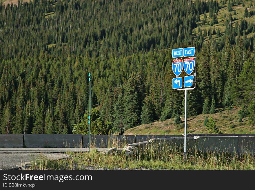 Route 70 road sign with arrows