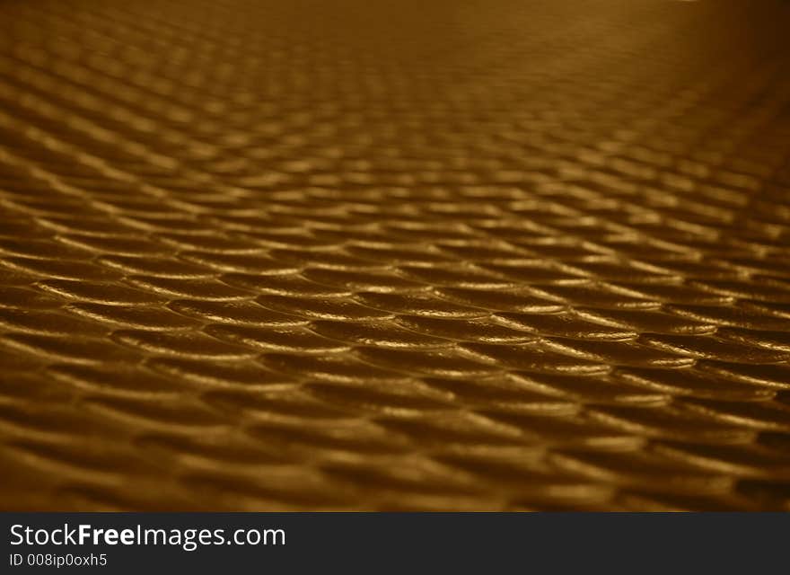 Wave like textured surface with golden colors