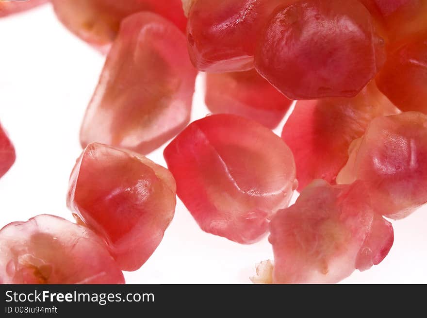 Close up macro shot of pomegranate seeds. One of the superfoods that can lower cholesterol. Close up macro shot of pomegranate seeds. One of the superfoods that can lower cholesterol