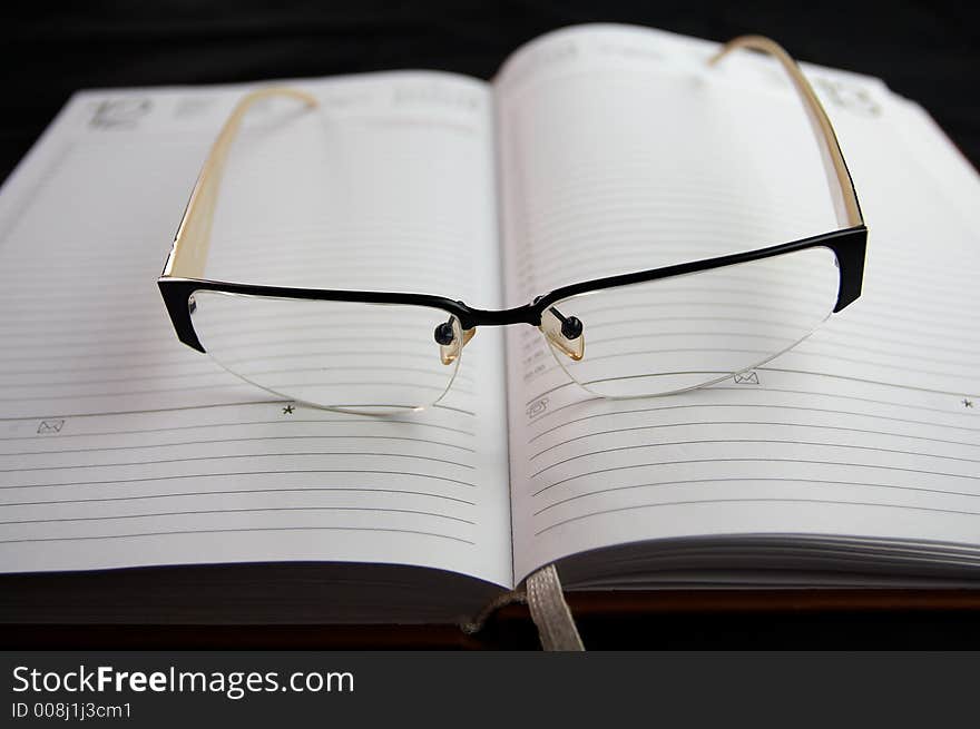 Eyeglasses on notebook