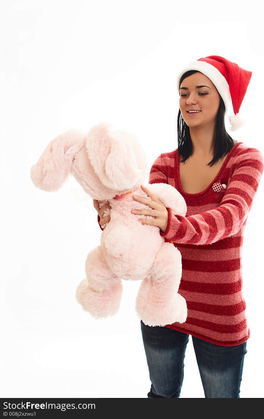 Young beauty girl in sweater  and santa wear with pink rabbi