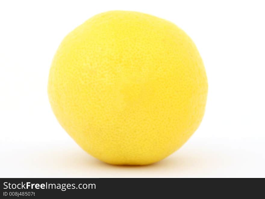 Fresh fruit, a tropical yellow lemon macro closeup, isolated on white, close-up with copyspace. Fresh fruit, a tropical yellow lemon macro closeup, isolated on white, close-up with copyspace