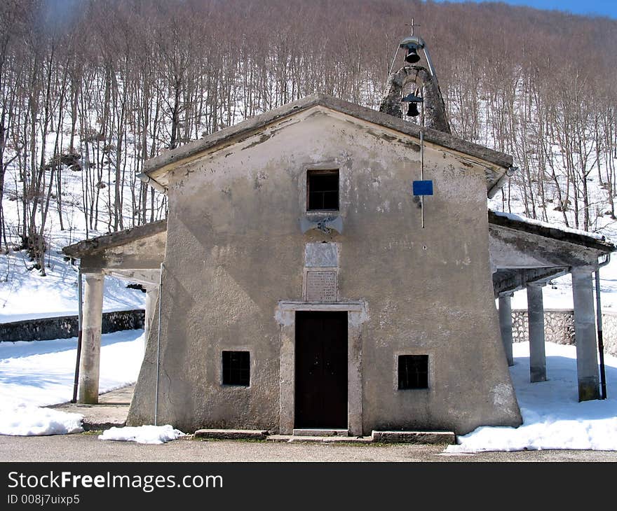 Small mountain Catholic church in a mountain landscape in Italy. Small mountain Catholic church in a mountain landscape in Italy