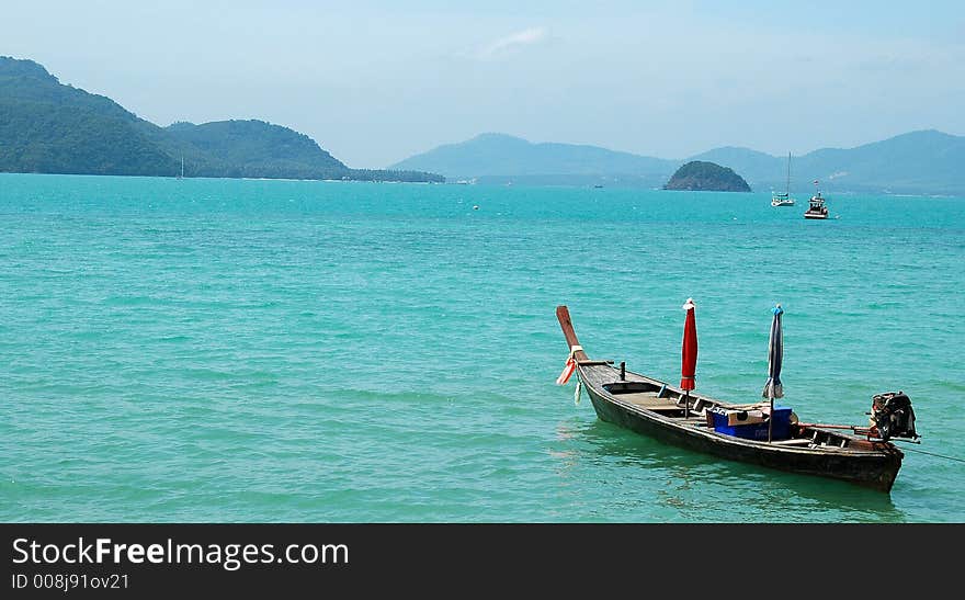 Shot of a boat in the sea from a Thailand shore. Shot of a boat in the sea from a Thailand shore.