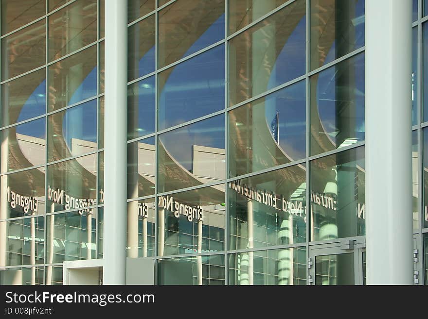 Reflection of the sky in a building from a glass and concrete