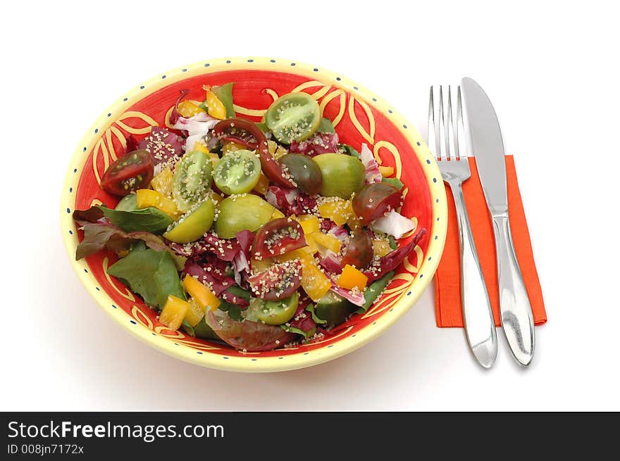 Healthy serving of salad isolated on a white background.