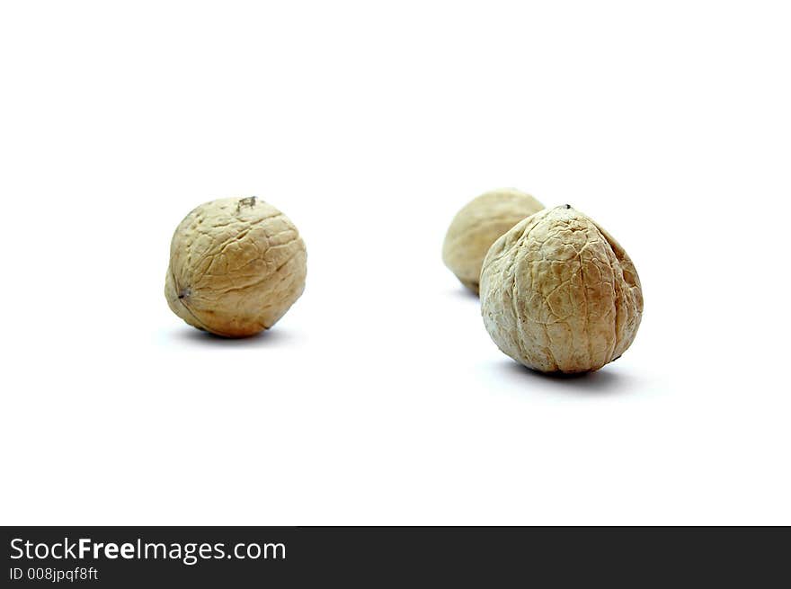 Three walnuts isolated on white