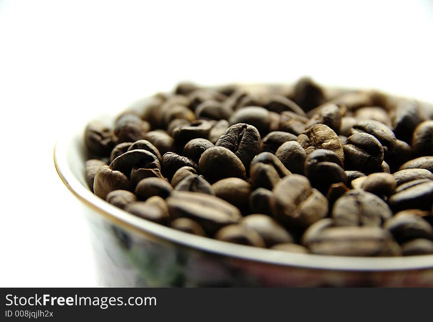 Photography of fresh natural coffee beans in cup