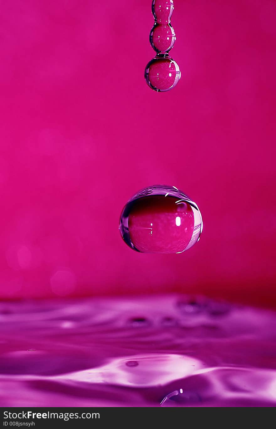 Frozen drop on purple background