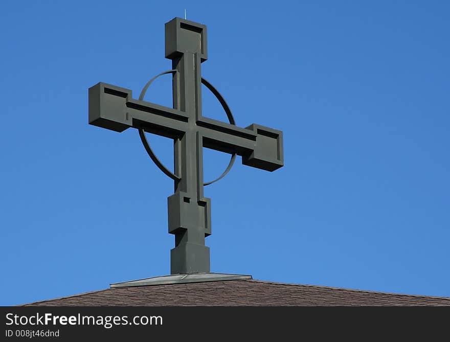 Large cross against a bright blue sky. Large cross against a bright blue sky