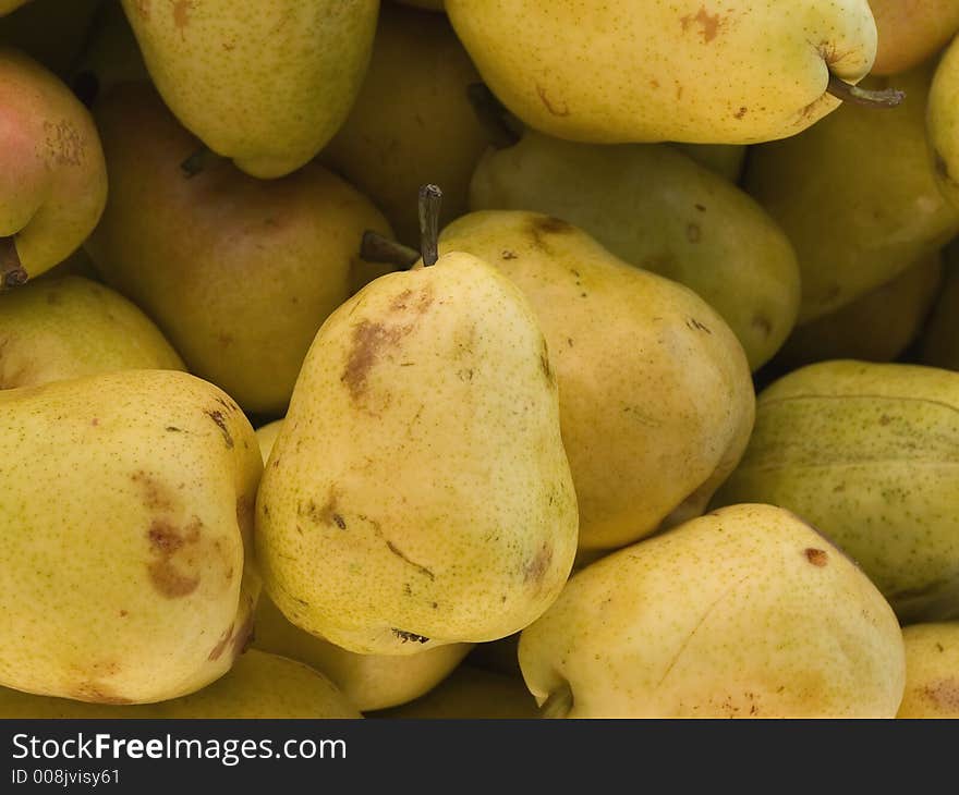 Box of pears for sale at a farmers market.