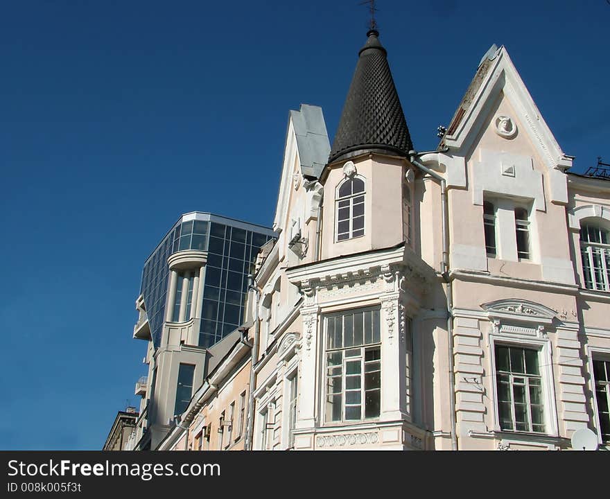 View of a modern and a historical buildings side by side. View of a modern and a historical buildings side by side