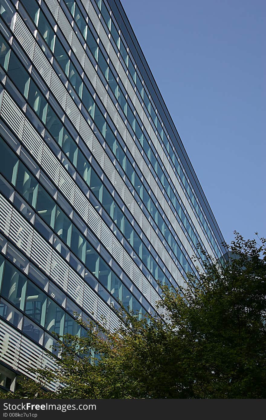 Windows on blue building against blue sky. Windows on blue building against blue sky