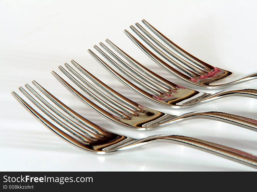 A row of four forks