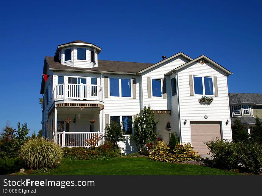 White home with turret.