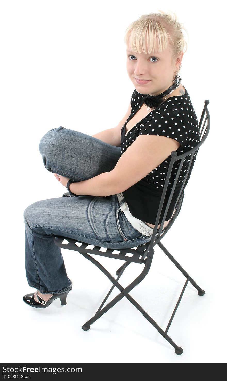 Portrait of beautiful seventeen year old girl.  Natural beauty, no make-up.  Sitting in black iron chair. Portrait of beautiful seventeen year old girl.  Natural beauty, no make-up.  Sitting in black iron chair.