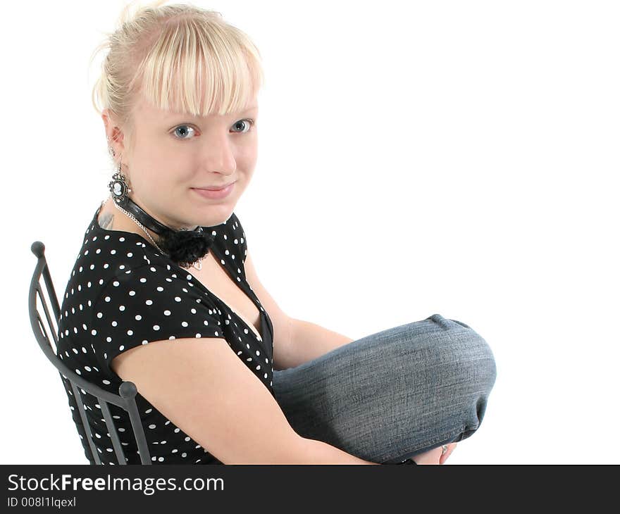 Portrait of beautiful seventeen year old girl.  Natural beauty, no make-up.  Sitting in black iron chair. Portrait of beautiful seventeen year old girl.  Natural beauty, no make-up.  Sitting in black iron chair.