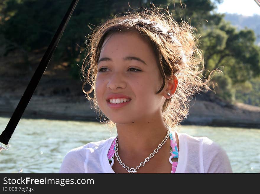 Happy asian girl boating on a lake. Happy asian girl boating on a lake