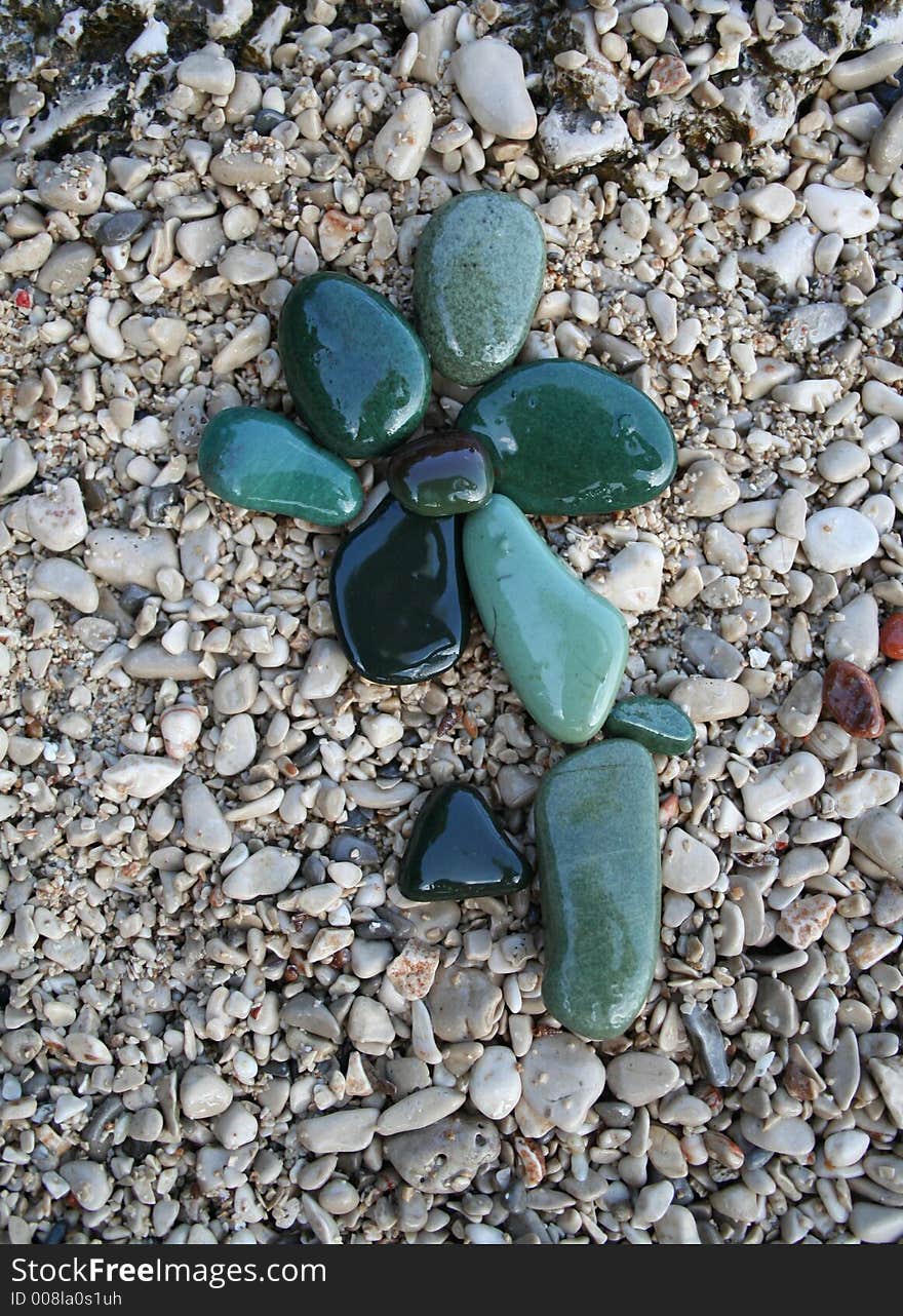 Green stones flower on the gray background