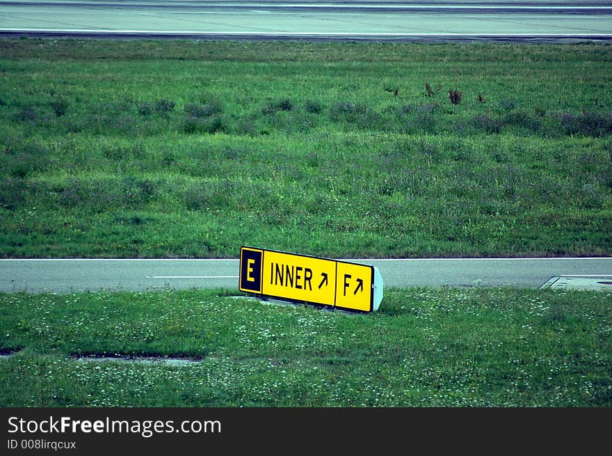 An aeroportual signal beside a taxiing track at kloten airport. An aeroportual signal beside a taxiing track at kloten airport.