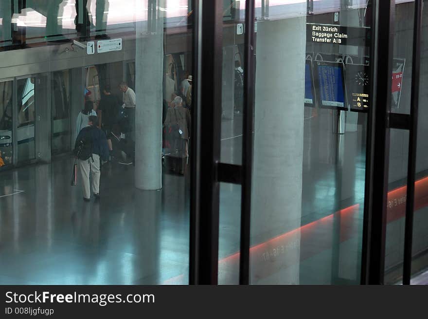 The train bringin the passengers to claim their luggages at kloten airport in zurich, szitzerland. The train bringin the passengers to claim their luggages at kloten airport in zurich, szitzerland