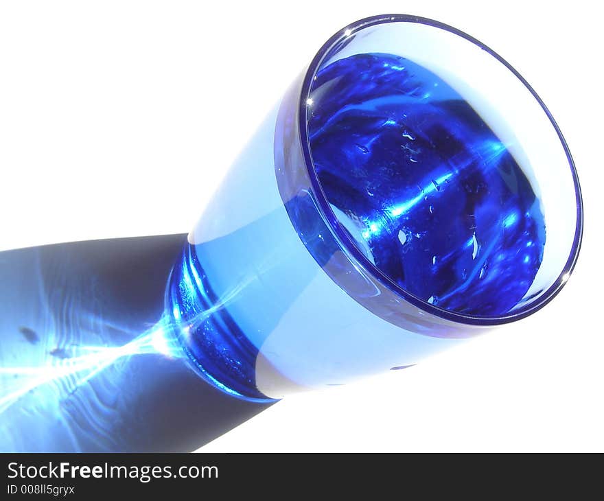 Isolated blue glass of water