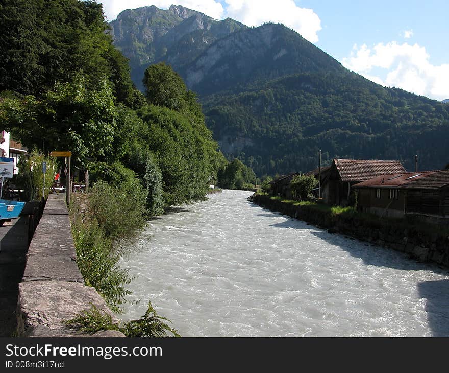 A view of the Lutschine river showing the white water as it passes a village in the Berenese Oberland mountains near Interlaken. A view of the Lutschine river showing the white water as it passes a village in the Berenese Oberland mountains near Interlaken.