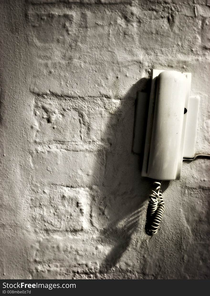 Phone on distressed wall