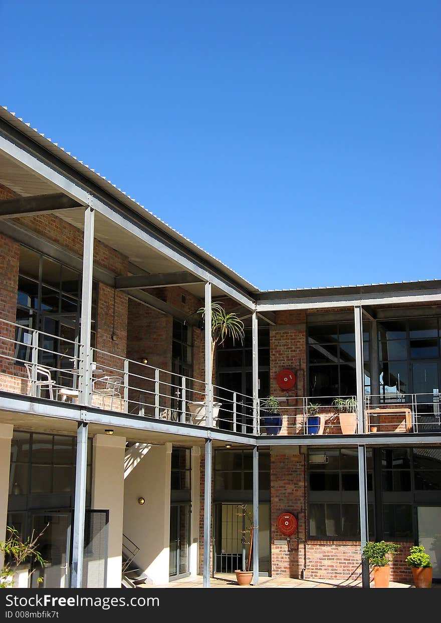 Portrait photograph of modern industrial building courtyard