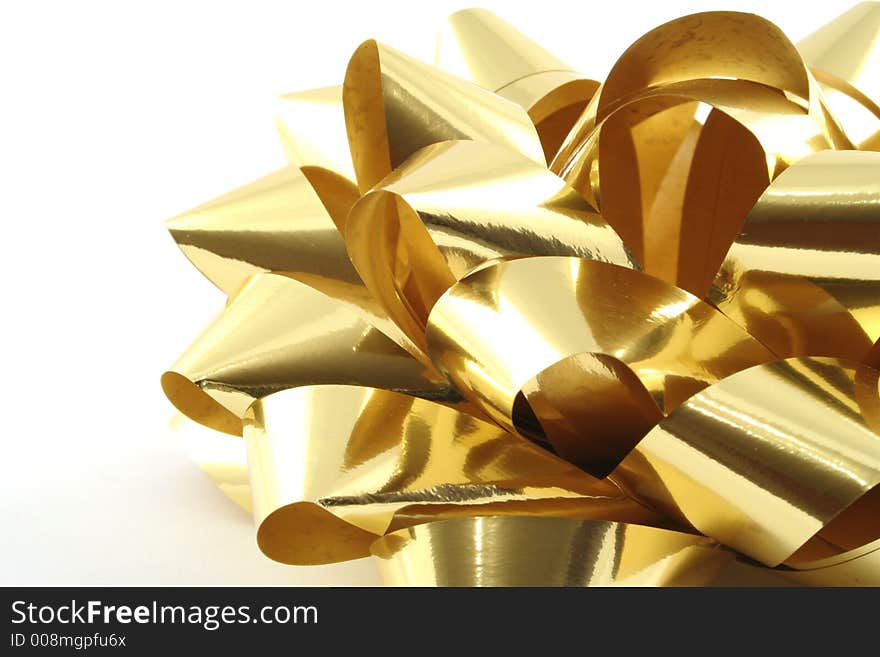 Gold gift ribbon on a white background