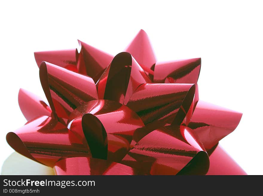 Ribbon on a gift box isolated over white. Ribbon on a gift box isolated over white