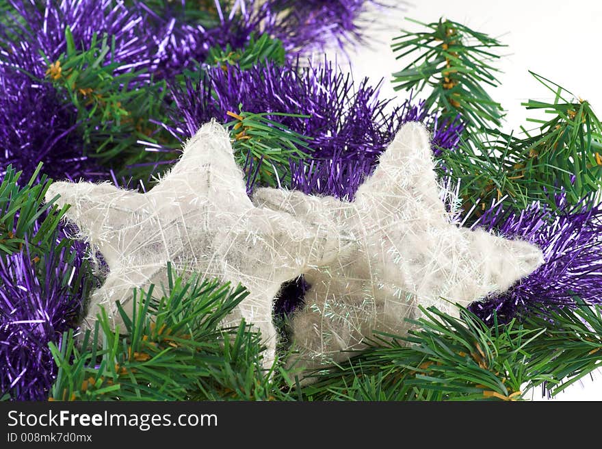 Christmas decoration with pine, white shiny stars and blue garland