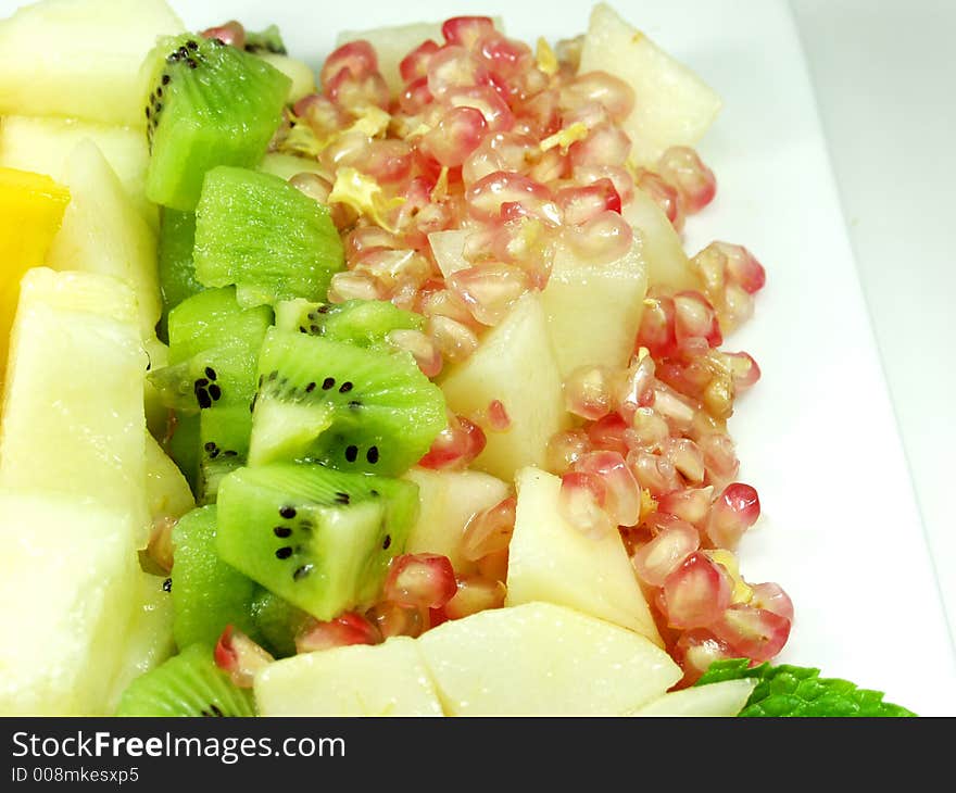 Fresh fruit white platter whit peppermint