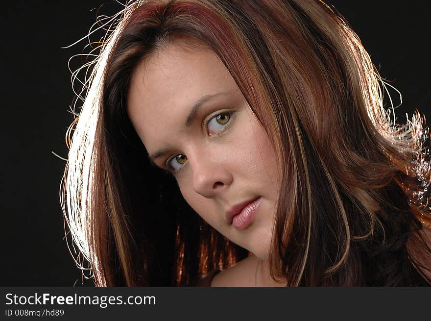 Portrait of a young girl with black baground