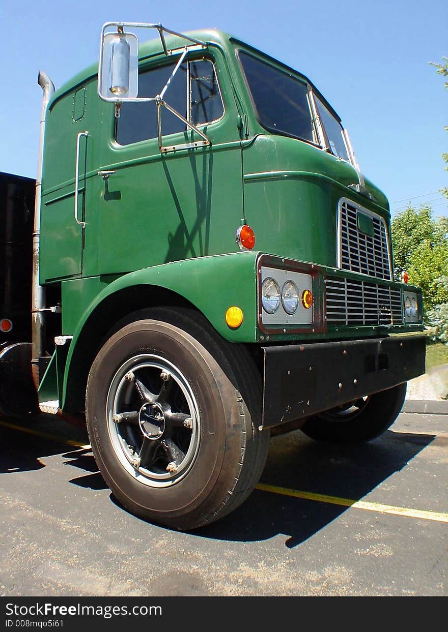 This is a classic cab-over truck that is ready to haul its next load. This is a classic cab-over truck that is ready to haul its next load.