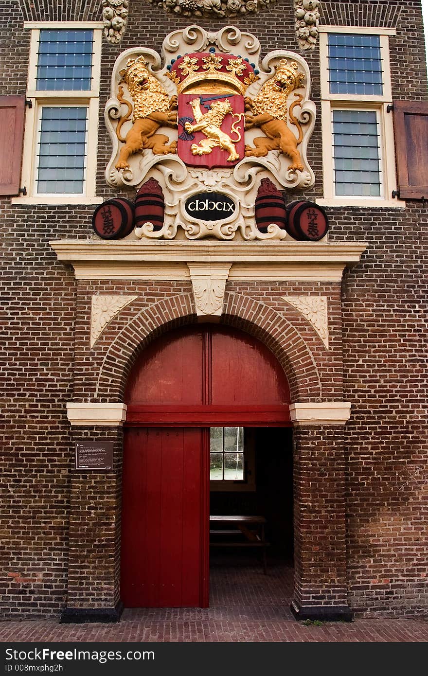 Coat of arms with golden lions sits above the entrance to an old powder magazine. Coat of arms with golden lions sits above the entrance to an old powder magazine