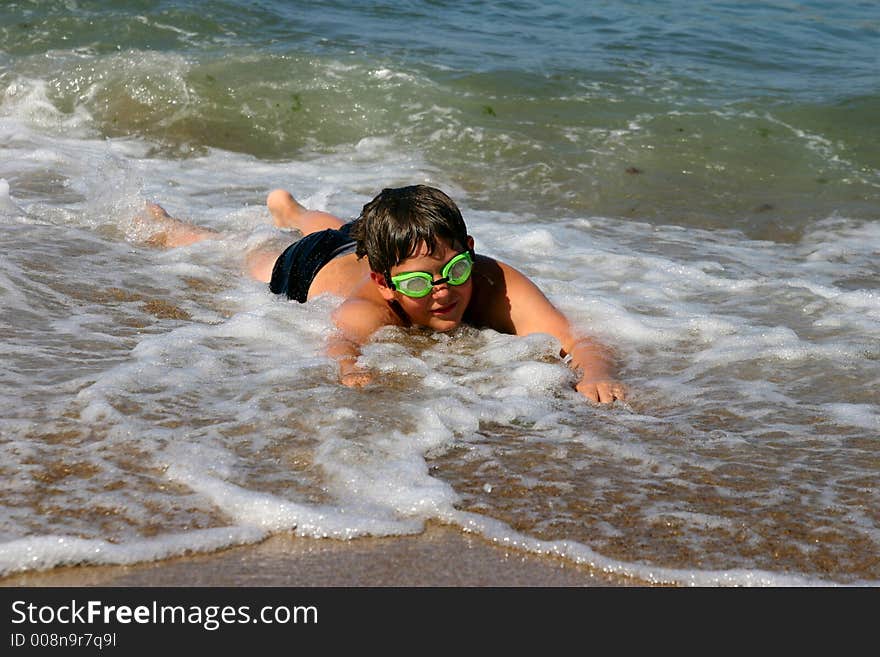 The teenager swimming in the sea