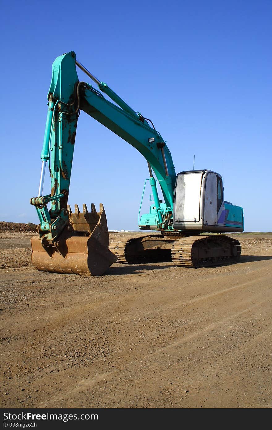 Earth mover excavator clear blue sky