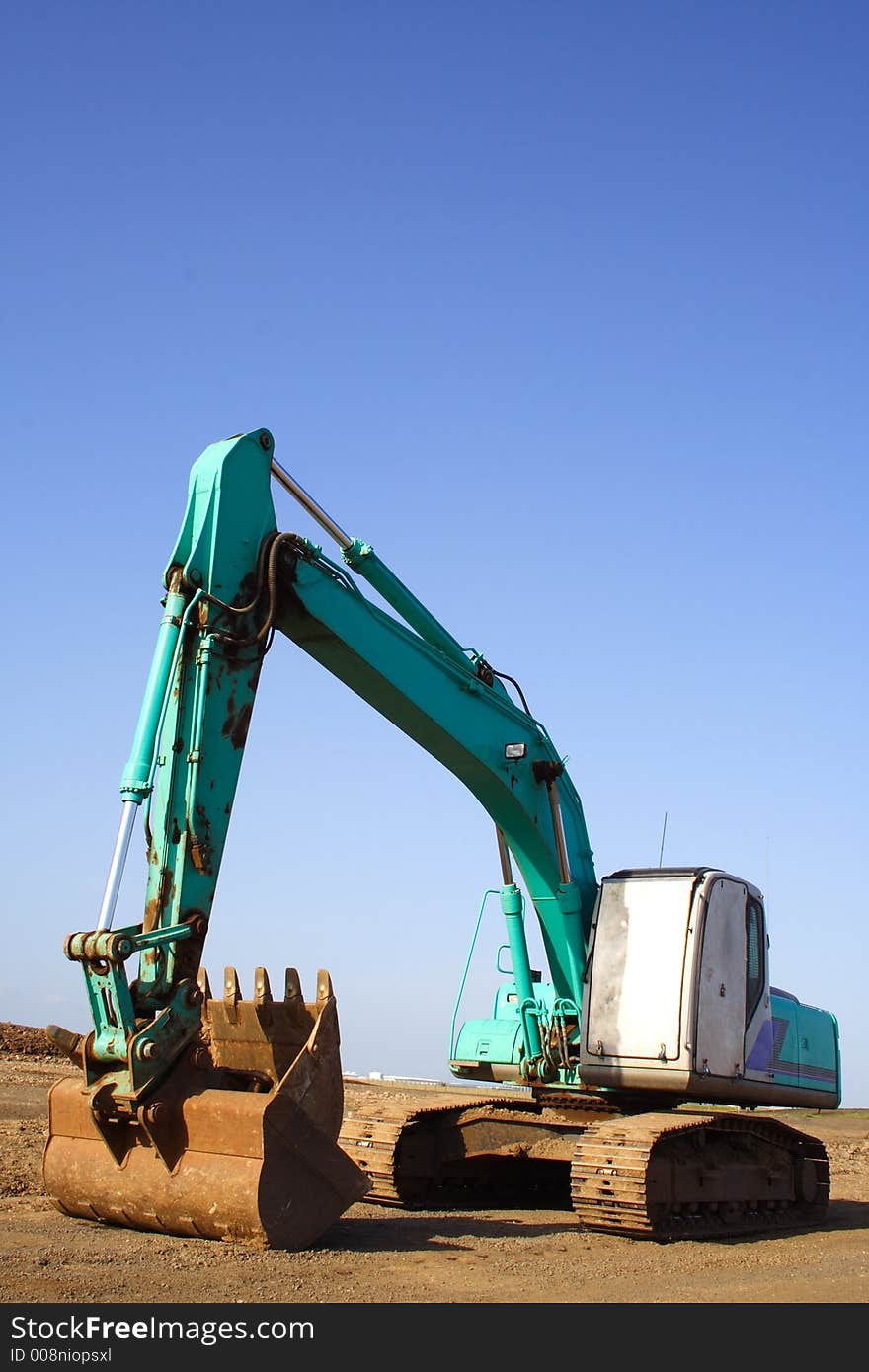 Earth mover excavator clear blue sky