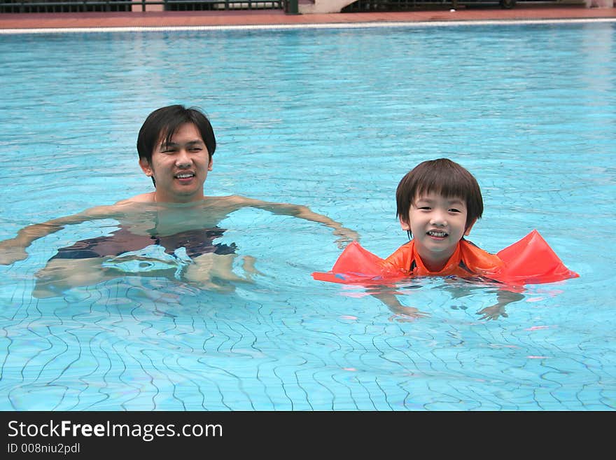 Man & Boy In The Pool