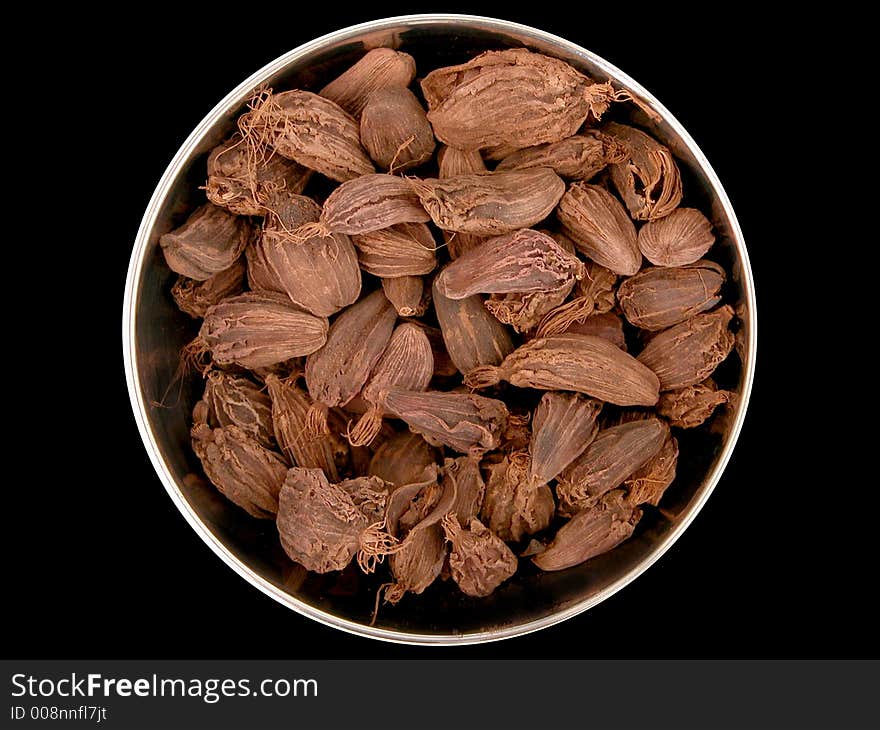 A selection of cooking spices on a plain background