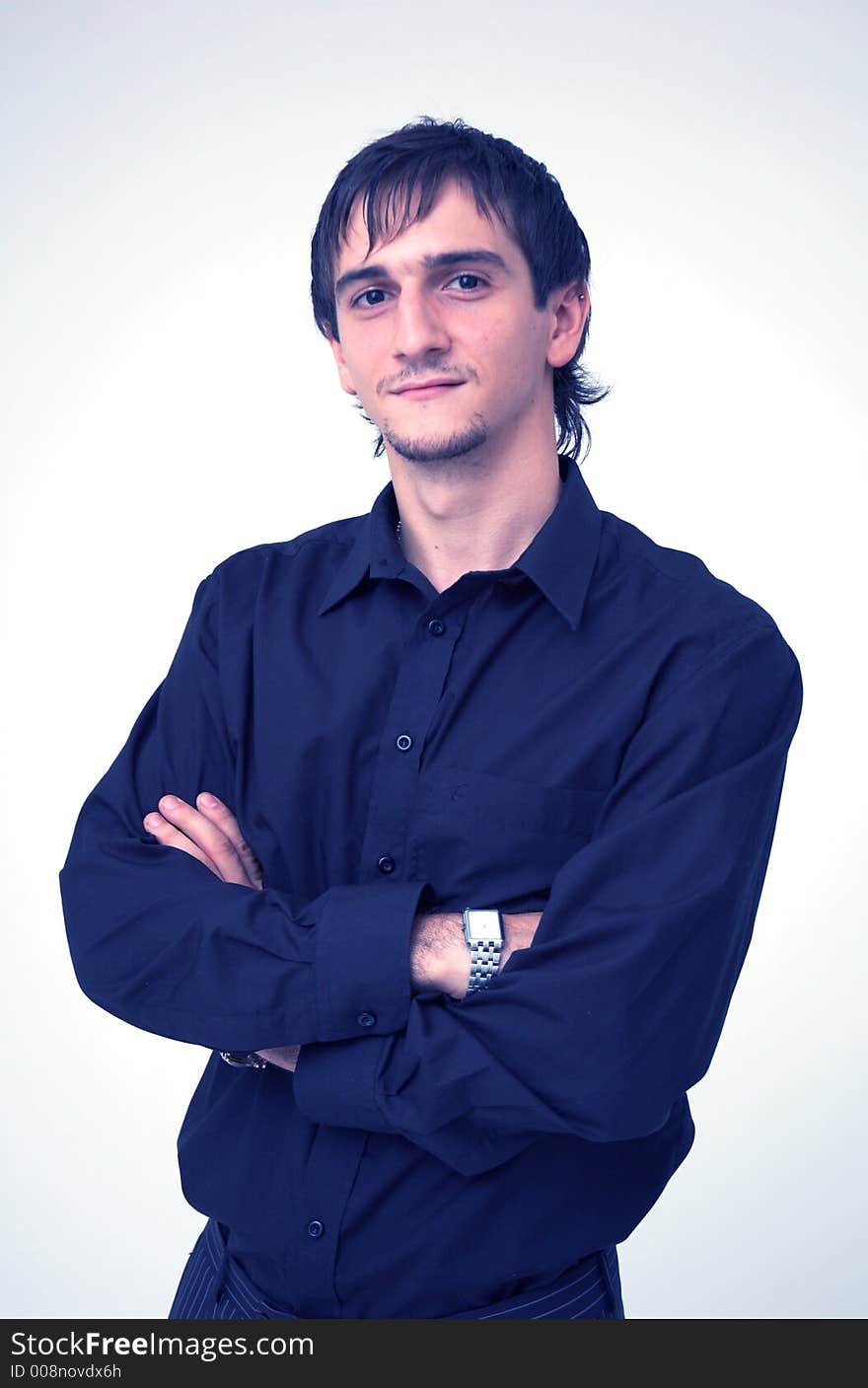 Portrait of a young boy wearing a black shirt posing in a studio; isolated on orange. Portrait of a young boy wearing a black shirt posing in a studio; isolated on orange