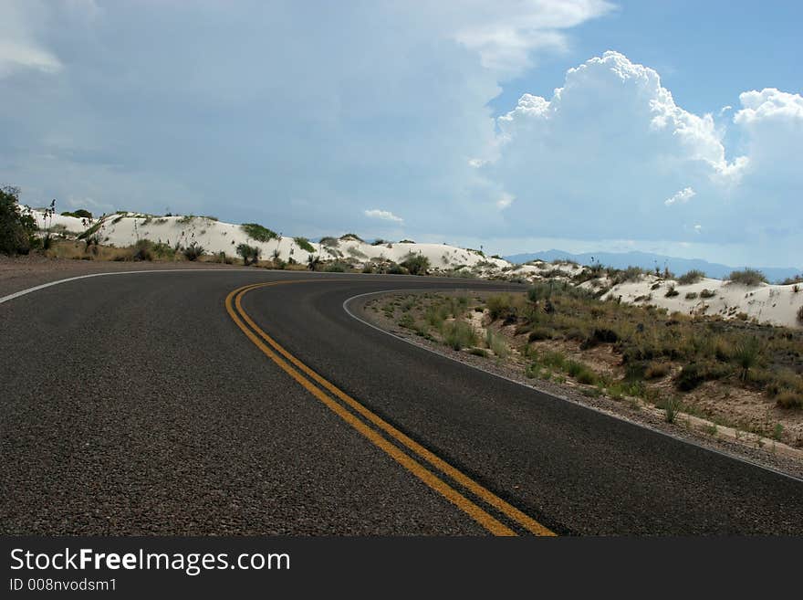 Desert highway in white sand dunes. Desert highway in white sand dunes