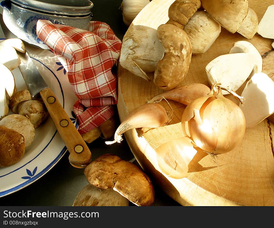 Wild mushrooms  in the sunset to be cleaned. Wild mushrooms  in the sunset to be cleaned