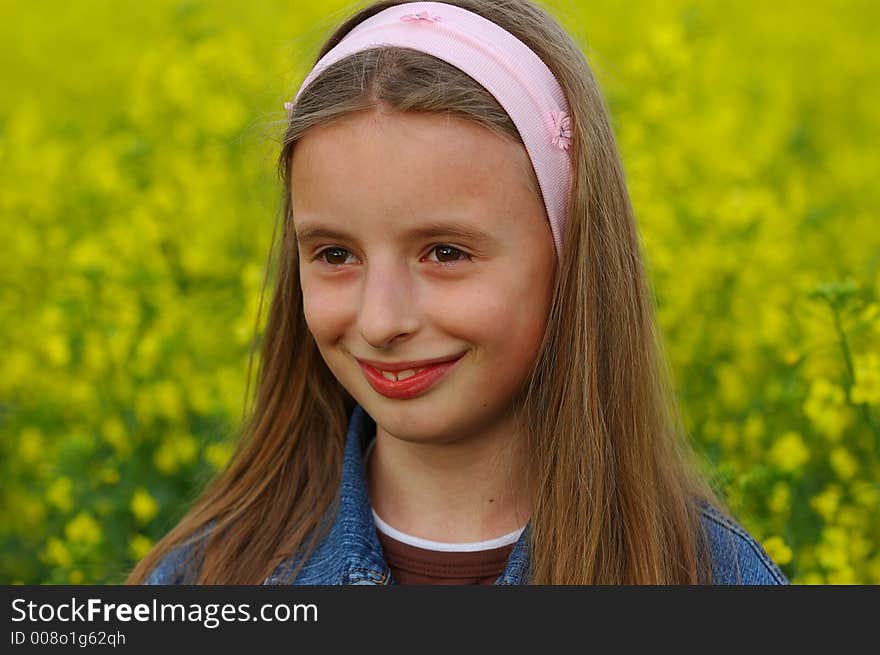 Portrait of young girl in yellow flowers