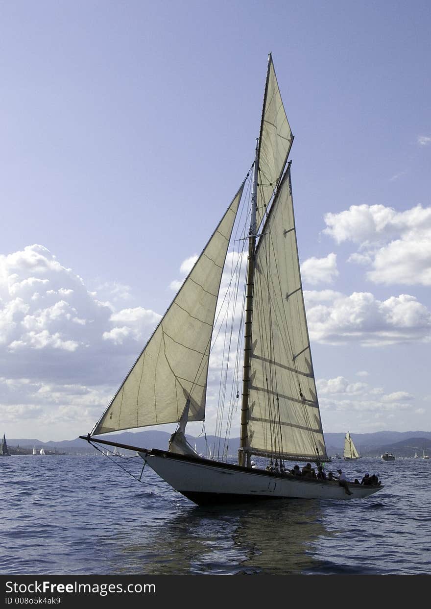 Traditional sailing yacht in a light breeze. Traditional sailing yacht in a light breeze